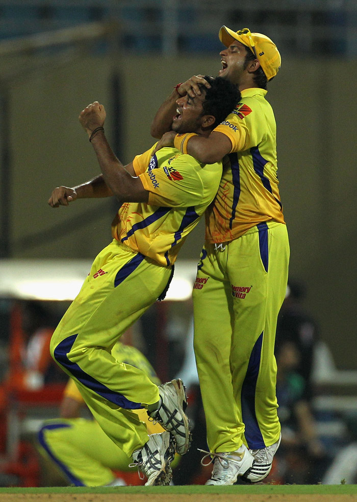 Shadab Jakati (L) of the Super Kings is congratulated by team mate Suresh Raina on the wicket of Monish Mishra of the Chargers during the 2010 DLF Indian Premier League T20 semi final match between Deccan Chargers and the Chennai Super Kings played at DY Patil Stadium on April 22, 2010 in Navi Mumbai, India.  (Photo: Getty Images)