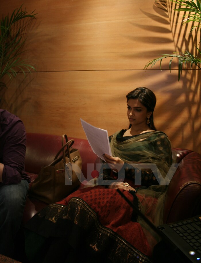 Deepika reading her script.