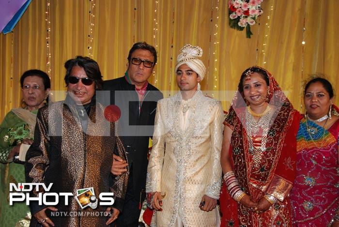 Actor Jackie Shroff poses with the couple and the bride's father, Dilip Sen.