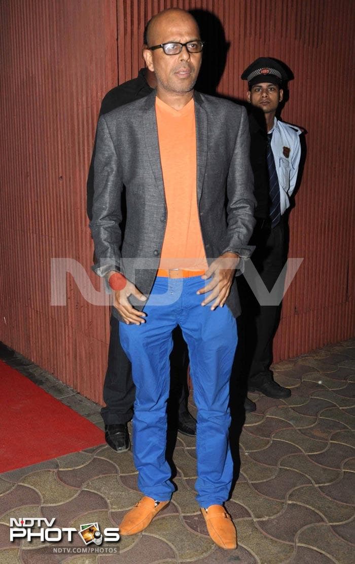 Designer Narendra Kumar combines blue and orange in his outfit.