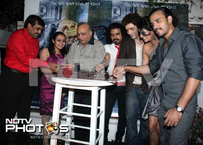 Actor Shiney Ahuja, producer Bharat Shah, director Puja Jatinder Bedi, actress Sayali Bhagat and singer Toshi celebrate the music release of their upcoming film <i>Ghost</i>.