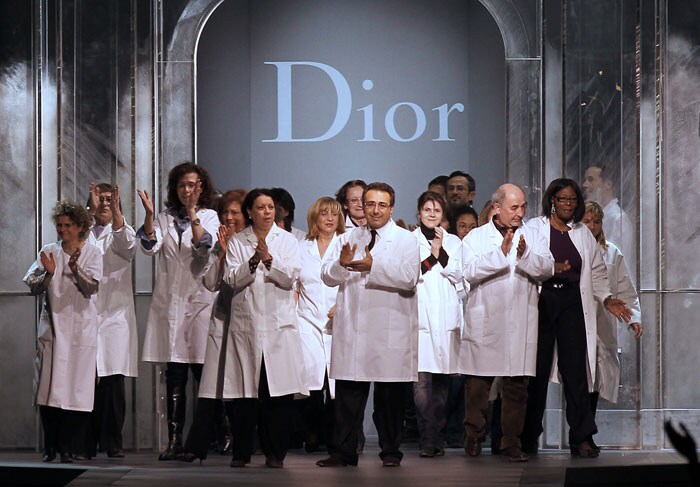 The design team of the House of Dior applaud after the showing of Christian Dior's Autumn/Winter ready to wear collection in Paris on March 4. Dior went ahead with the show even as design head, John Galliano, was sacked after the release of a videotaped anti-Semitic rant <br><bR><b>Pics</b>:<b><a href="http://www.ndtv.com/album/detail/gallianos-drama-and-brilliance-9250" ;="" style="color: rgb(0, 51, 153);">Galliano's Drama And Brilliance</a></b>