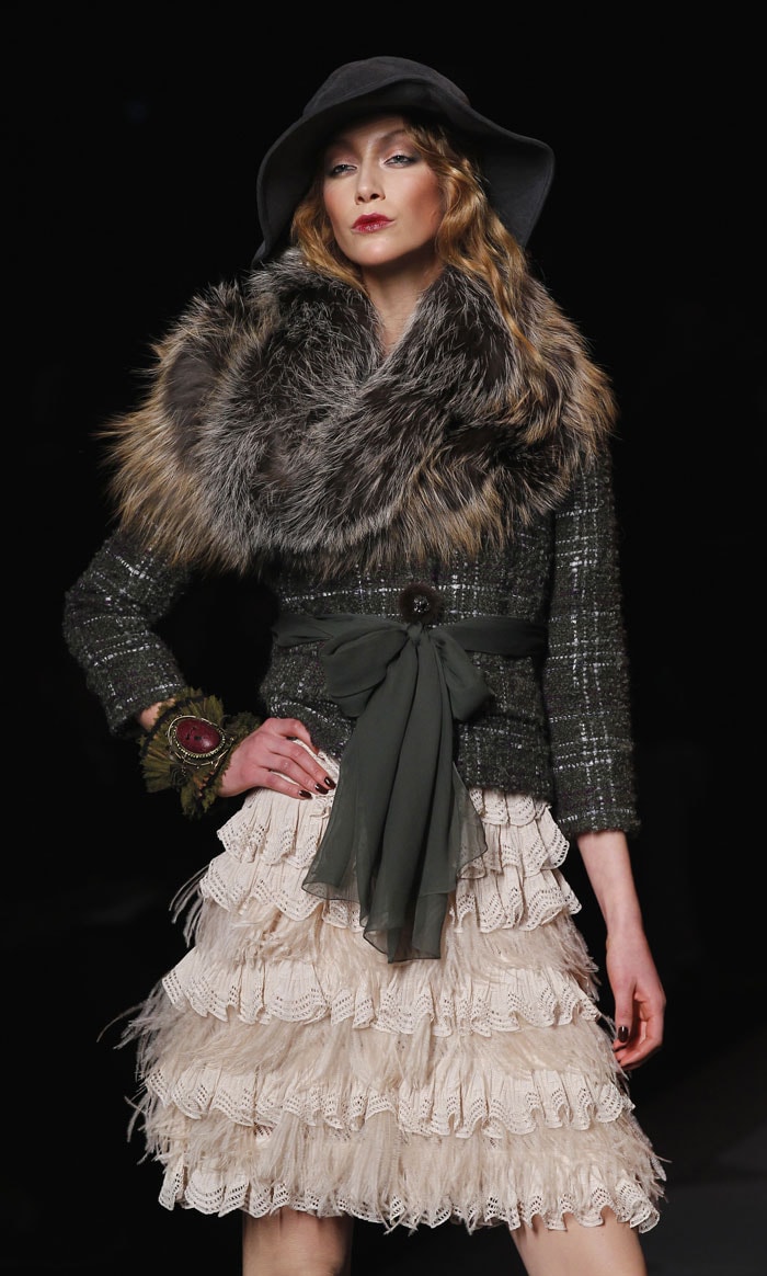 Galliano's sense of drama was showcased with boucle jackets mixed up with poetic chiffon and lace<br><bR><b>Pics</b>:<b><a href="http://www.ndtv.com/album/detail/gallianos-drama-and-brilliance-9250" ;="" style="color: rgb(0, 51, 153);">Galliano's Drama And Brilliance</a></b>