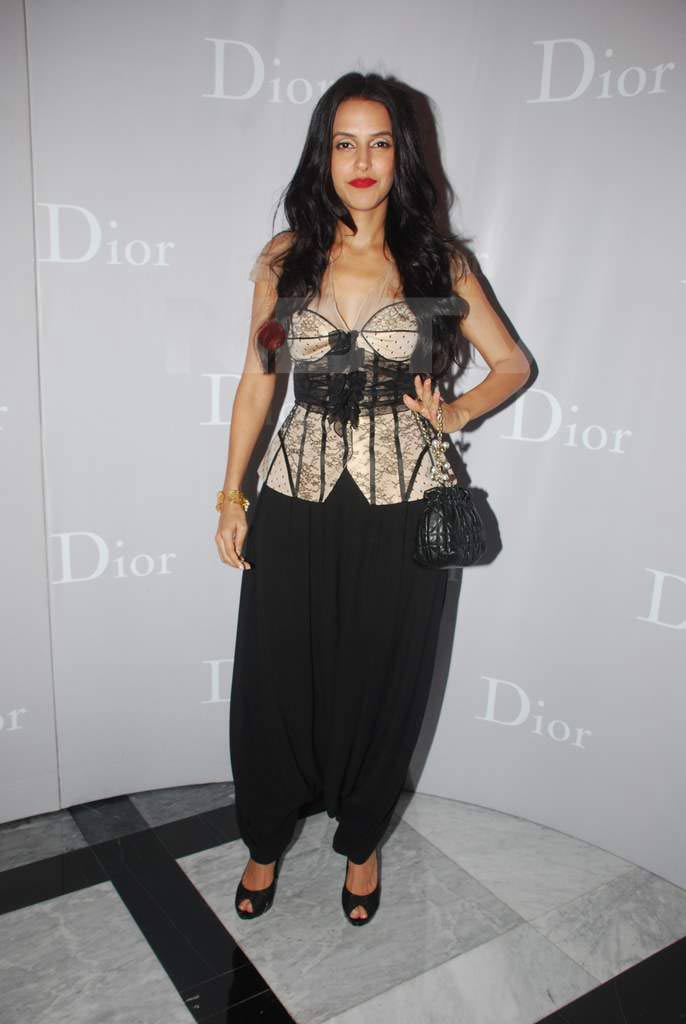 Lady Alladin: Neha Dhupia teams up a sexy corset with Alladin trousers, topping it with a bold red lip colour!