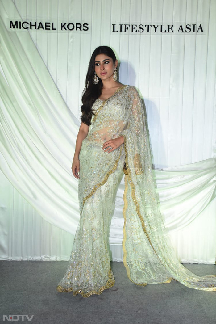 Mouni Roy opted for a sheer saree. (Image Courtesy: Varinder Chawla)