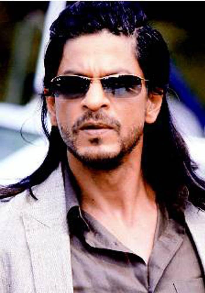 Shah Rukh's return to the Don series is not all suave, not visually anyway. The superstar has also donned a violent look with unkempt long locks and a disconcerting graying beard.