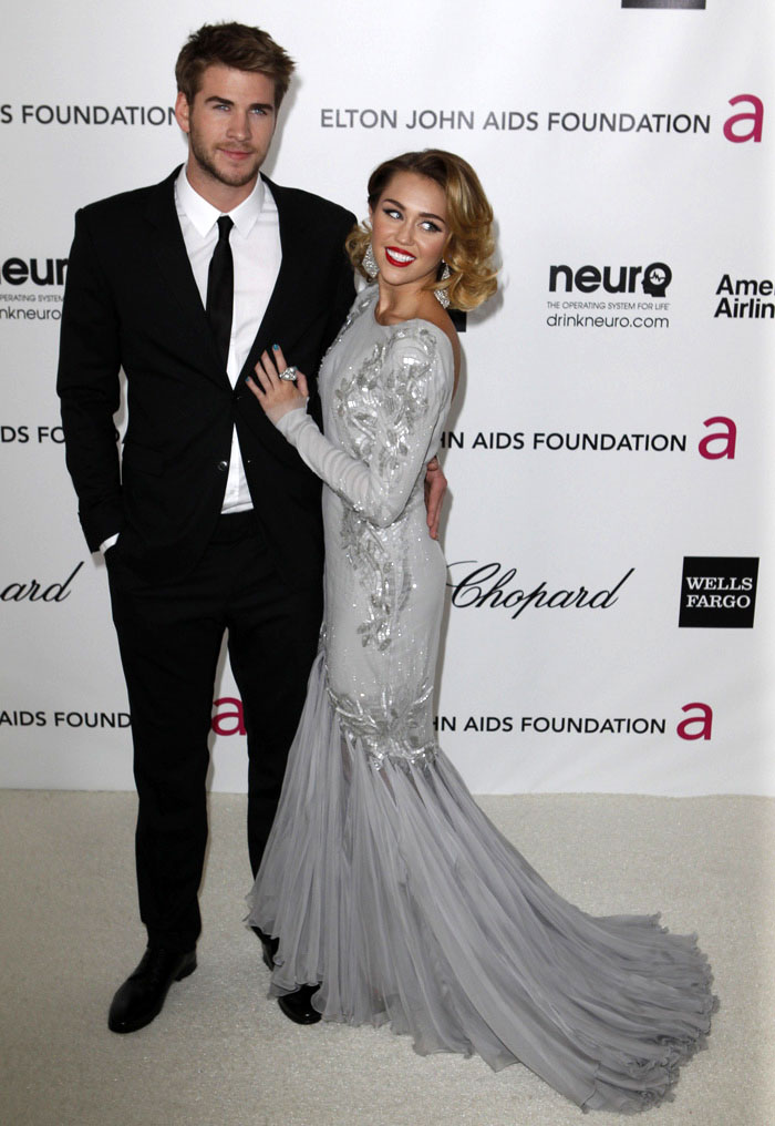 Miley Cyrus dressed in Roberto Cavalli, walked in hand in hand with her boyfriend Liam Hemsworth.