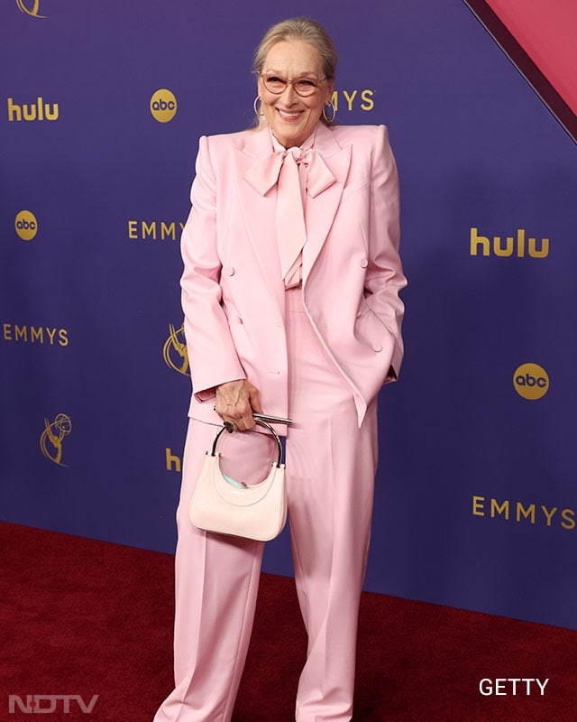 Meryl Streep, nominated for Best Supporting Actress in a comedy for <i>Only Murders in the Building</i>, added a touch of pink to the red carpet in a stylish tuxedo. (Image Courtesy: Getty)