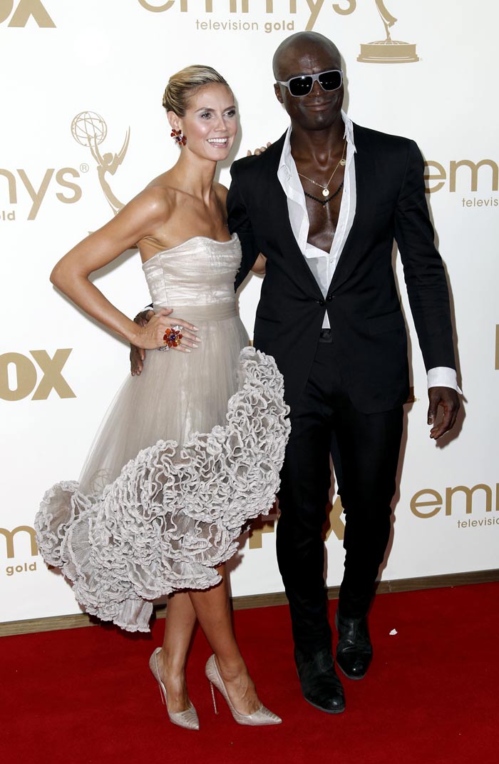 Seal made his own style statement in a barely buttoned shirt and black suit. Seen here with wife Heidi.