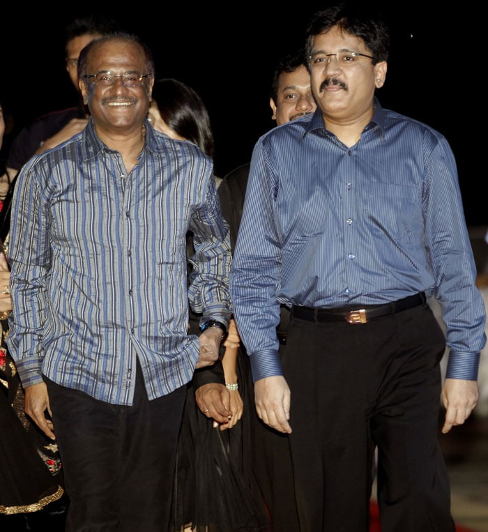 Rajinikanth walks with Sun Network Managing Director Kalanidhi Maran as they arrive for the audio launch of <i>Endhiran</i> at the Putrajaya International Convention Centre in Putrajaya on July 31, 2010. (Photo: AFP)