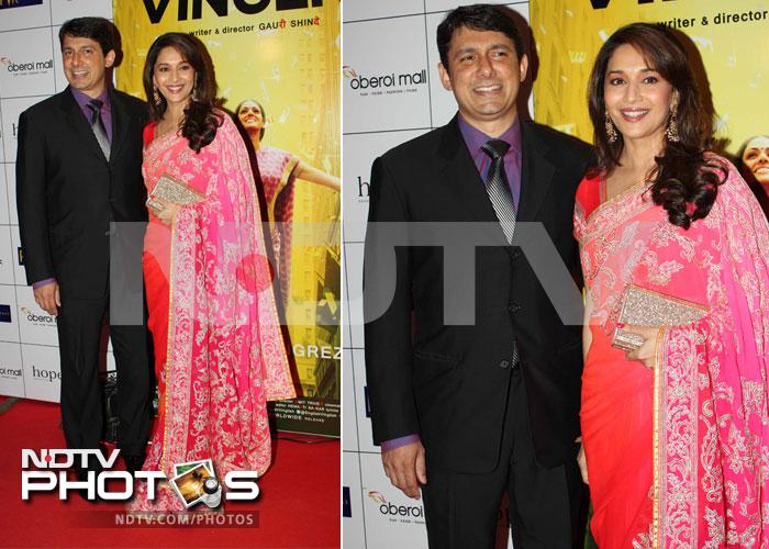 Madhuri Dixit was on hand to wish her one time rival Sridevi luck. She looked gorgeous in a double shaded sari. In this picture she is seen with her husband Dr Sriram Nene.