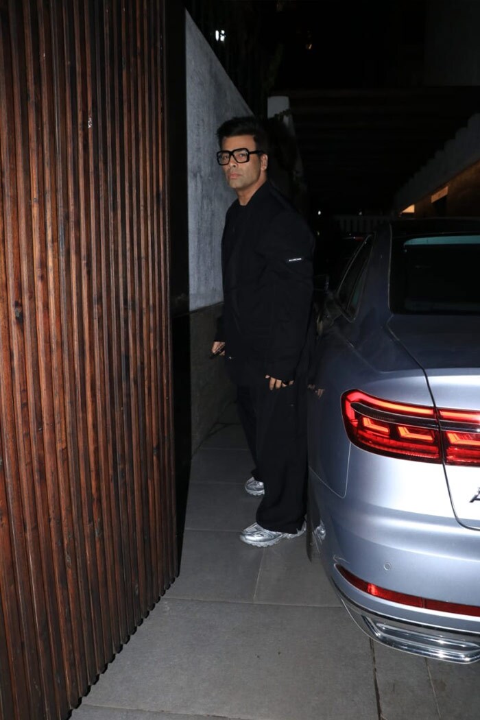 Looking his best, Karan Johar attended Farhan Akhtar's party in a black suit