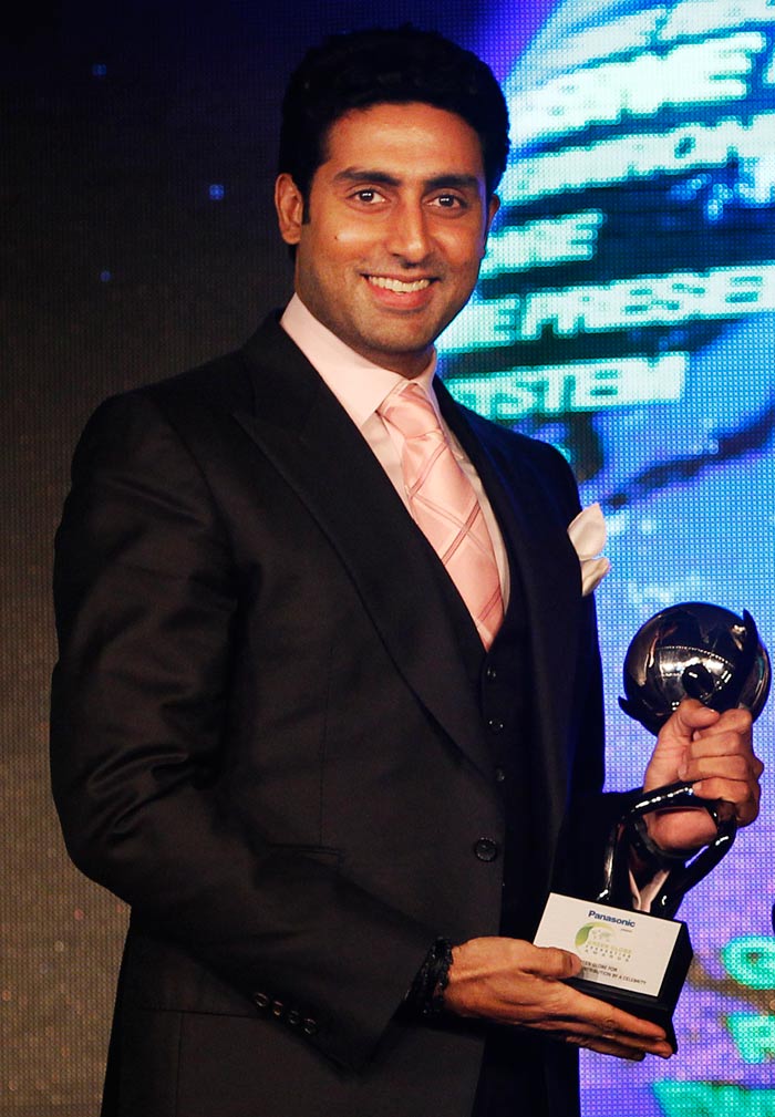 Abhishek Bachchan poses with the the Green Globe award.