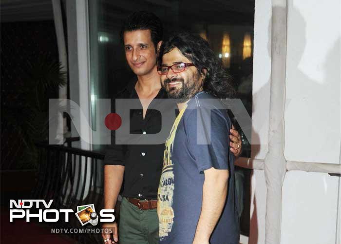 Sharman greets music director of his film, Pritam.
