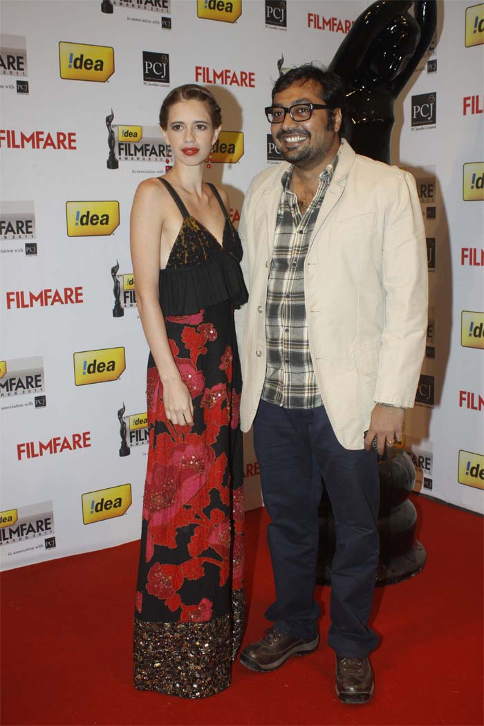 Kalki Koechlin and Anurag Kashyap smile on the red carpet.