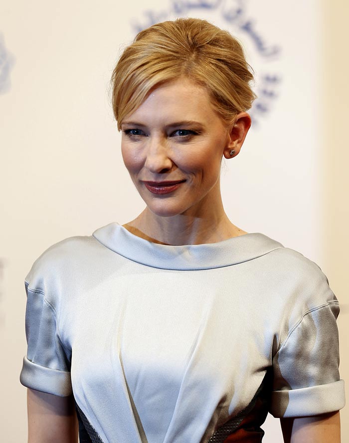 Cate had her hair up and wore dark lipstick to go with the pale gown.