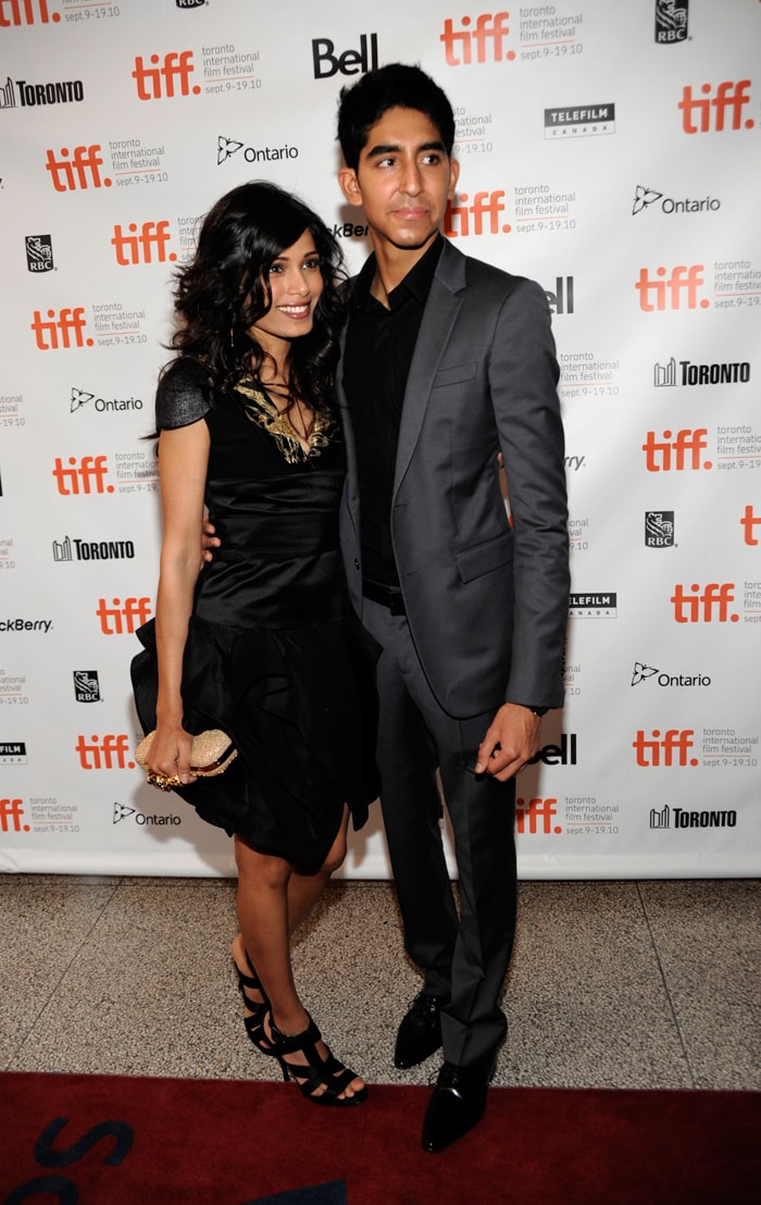 Actress Freida Pinto, left, and actor Dev Patel arrive at the premiere of the feature film <i>You Will Meet a Tall Dark Stranger</i> during the Toronto International Film Festival in Toronto.