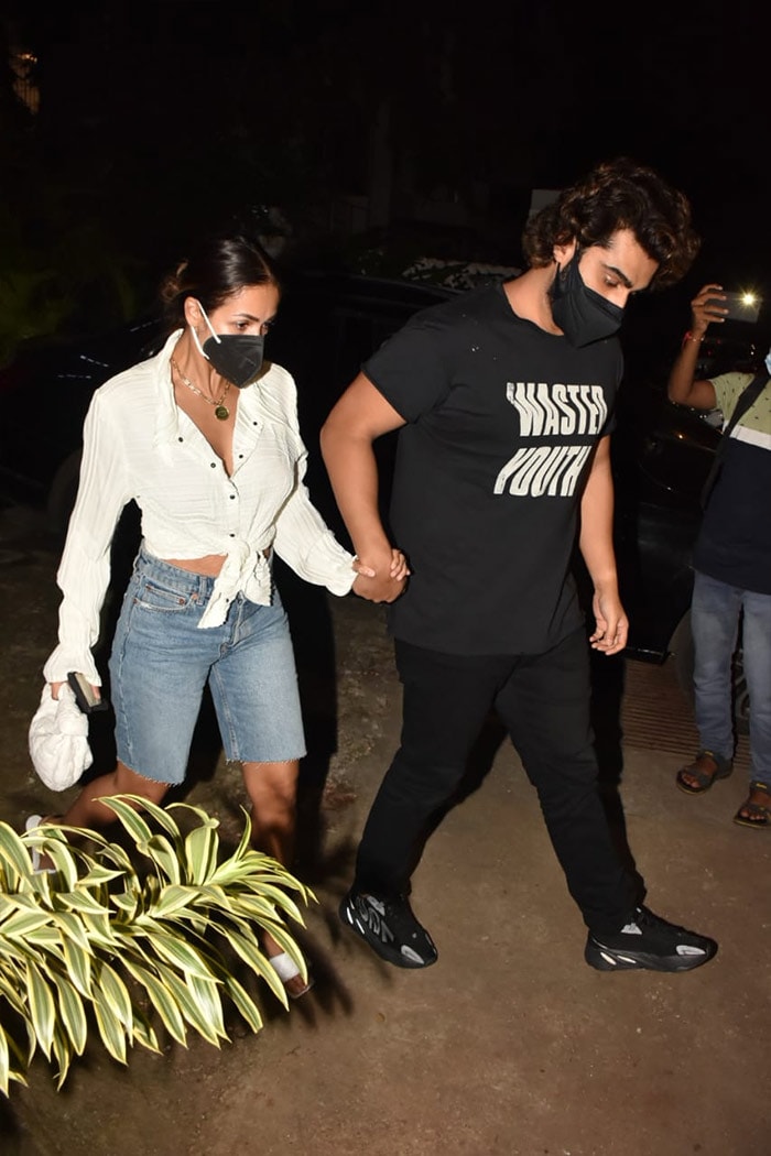 Malaika Arora opted for a white shirt and a pair of denim shorts, while Arjun kept it casual in black.