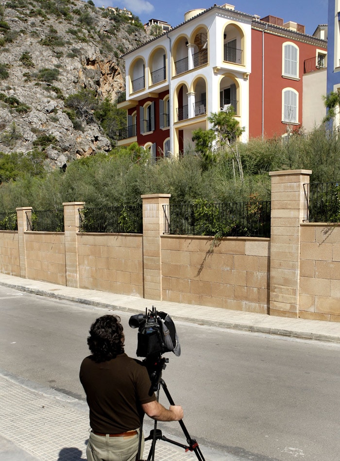 A cameraman films the house where Boyzone lead singer Stephen Gately of Ireland died while on vacation in the village of Cala Llamp on the Spanish island of Majorca on October 11, 2009. Ronan Keating was in Chicago to run a marathon when he was told of his bandmate's tragic death. "I'm absolutely devastated. I can't believe it's real. Stephen was loved by every one of us. He was one of the most caring, compassionate an gentle people I've ever known," he was quoted as saying. (Photo: AFP)