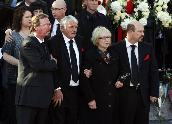 The parents of Stephen Gately Martin Gately (2nd L) and Margarent Gately (2ndR) look on as the coffin carring the body of Stephen Gately, the Irish singer from pop group Boyzone is carried from St Laurence O'Toole's Church in Dublin, on October 17, 2009. An autopsy on Stephen Gately revealed that he died due to excess fluid in his lungs, a court spokeswoman on the Spanish island of Majorca said on October 13. Gately, 33, was found dead on October 10 in his apartment in the Majorcan town of Port Andratx while on holiday on the Mediterranean island. News reports said he had been out late the night before. Gately, who married his partner Andrew Cowles in a civil union in 2006, sent ripples through the pop music world 10 years ago when he announced that he was gay. (Photo: AFP)