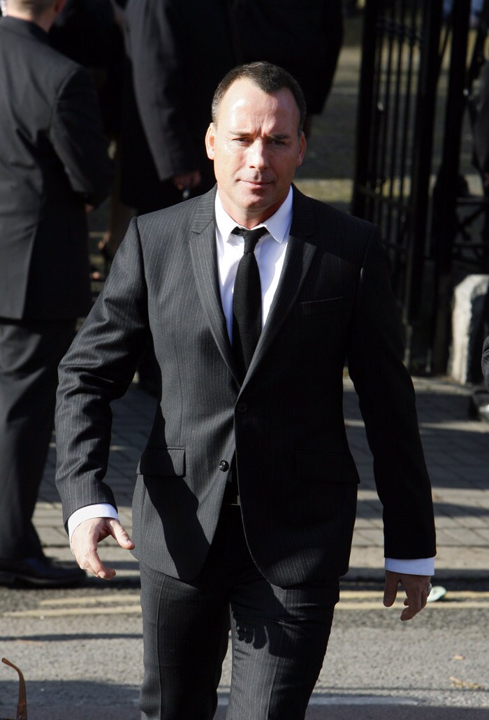 David Furnish, partner of singer Elton John walks to St Laurence O'Toole's Church in Dublin, for Stephen Gatley's funeral on October 17, 2009. An autopsy on Stephen Gately revealed that he died due to excess fluid in his lungs, a court spokeswoman on the Spanish island of Majorca said on October 13. Gately, 33, was found dead on October 10 in his apartment in the Majorcan town of Port Andratx while on holiday on the Mediterranean island. News reports said he had been out late the night before. Gately, who married his partner Andrew Cowles in a civil union in 2006, sent ripples through the pop music world 10 years ago when he announced that he was gay. (Photo: AFP)