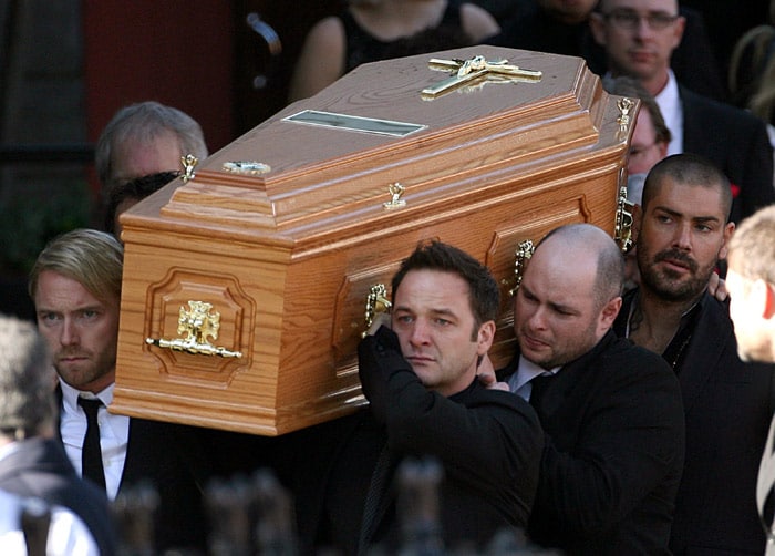 Members of Irish band Boyzone, Ronan Keating, foreground left, Mikey Graham foreground centre, and Shane Lynch background right, carry the coffin of fellow band member Stephen Gately from St. Laurence O'Toole Church, after the funeral service, in Dublin, Ireland, Saturday Oct. 17, 2009. Gately was found dead on Saturday, Oct. 10, 2009,  in a house near Port d'Andratx on the western tip of Mallorca. The singer had gone to Mallorca with his partner Andrew Cowles. The two were wed in a civil union in 2006. Autopsy results released on Tuesday showed Gately died of natural causes. (Photo: AP)