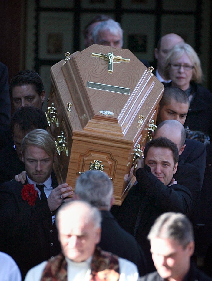 Members of Irish band Boyzone, Ronan Keating, foreground left, Mikey Graham foreground right, Keith Duffy, background left, partially seen, and Shane Lynch background right, carry the coffin of fellow band member Stephen Gately from St. Laurence O'Toole Church, after the funeral service, in Dublin, Ireland, Saturday Oct. 17, 2009. Gately was found dead on Saturday, Oct. 10, 2009, in a house near Port d'Andratx on the western tip of Mallorca. The singer had gone to Mallorca with his partner Andrew Cowles. The two were wed in a civil union in 2006. Autopsy results released on Tuesday showed Gately died of natural causes. (Photo: AP)