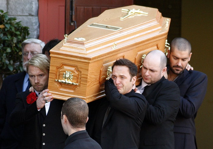 Members of Irish band Boyzone, Ronan Keating, foreground left, Mikey Graham foreground centre, and Shane Lynch background right, carry the coffin of fellow band member Stephen Gately from St. Laurence O'Toole Church, after the funeral service, in Dublin, Ireland, Saturday Oct. 17, 2009. Gately was found dead on Saturday, Oct. 10, 2009,  in a house near Port d'Andratx on the western tip of Mallorca. The singer had gone to Mallorca with his partner Andrew Cowles. The two were wed in a civil union in 2006. Autopsy results released on Tuesday showed Gately died of natural causes. (Photo: AP)