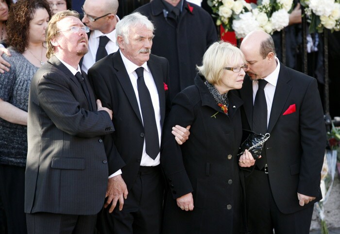 Parents of Irish band Boyzone's Stephen Gately, Martin and Margaret Gately, centre, attend the funeral of their son Stephen Gately at St. Laurence O'Toole Church,  in Dublin, Ireland, Saturday Oct. 17, 2009. Gately was found dead on Saturday, Oct. 10, 2009, in a house near Port d'Andratx on the western tip of Mallorca. The singer had gone to Mallorca with his partner Andrew Cowles. The two were wed in a civil union in 2006. Autopsy results released on Tuesday showed Gately died of natural causes. (Photo: AP)