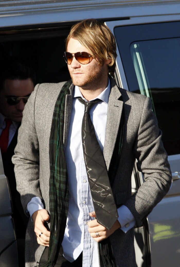 Singer Brian Mc Fadden attends the funeral of Stephen Gately from Irish band Boyzone, at St. Laurence O'Toole Church, in Dublin, Ireland, Saturday Oct. 17, 2009. Gately was found dead on Saturday, Oct. 10, 2009, in a house near Port d'Andratx on the western tip of Mallorca. The singer had gone to Mallorca with his partner Andrew Cowles. The two were wed in a civil union in 2006. Autopsy results released on Tuesday showed Gately died of natural causes. Photo of Gately seen on the right. (Photo: AP)