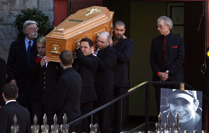 The coffin carrying the body of Stephen Gately, the Irish singer from pop group Boyzone is carried by Ronan Keating (L), Mickey Graham (2nd L) Undentified, and (2nd R) and Shane Lynch (R) from St Laurence O'Toole's Church in Dublin, on October 17, 2009. An autopsy on Stephen Gately revealed that he died due to excess fluid in his lungs, a court spokeswoman on the Spanish island of Majorca said on October 13. Gately, 33, was found dead on October 10 in his apartment in the Majorcan town of Port Andratx while on holiday on the Mediterranean island. News reports said he had been out late the night before. Gately, who married his partner Andrew Cowles in a civil union in 2006, sent ripples through the pop music world 10 years ago when he announced that he was gay. (Photo: AFP)