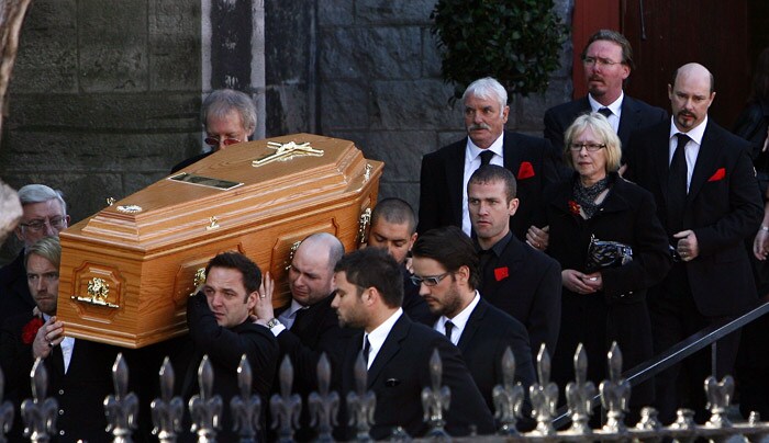 The coffin carrying the body of Stephen Gately, the Irish singer from pop group Boyzone is carried by Mickey Graham (L) Undentified (C), and Shane Lynch (R) from St Laurence O'Toole's Church in Dublin, on October 17, 2009. An autopsy on Stephen Gately revealed that he died due to excess fluid in his lungs, a court spokeswoman on the Spanish island of Majorca said on October 13. Gately, 33, was found dead on October 10 in his apartment in the Majorcan town of Port Andratx while on holiday on the Mediterranean island. News reports said he had been out late the night before. Gately, who married his partner Andrew Cowles in a civil union in 2006, sent ripples through the pop music world 10 years ago when he announced that he was gay. (Photo: AFP)