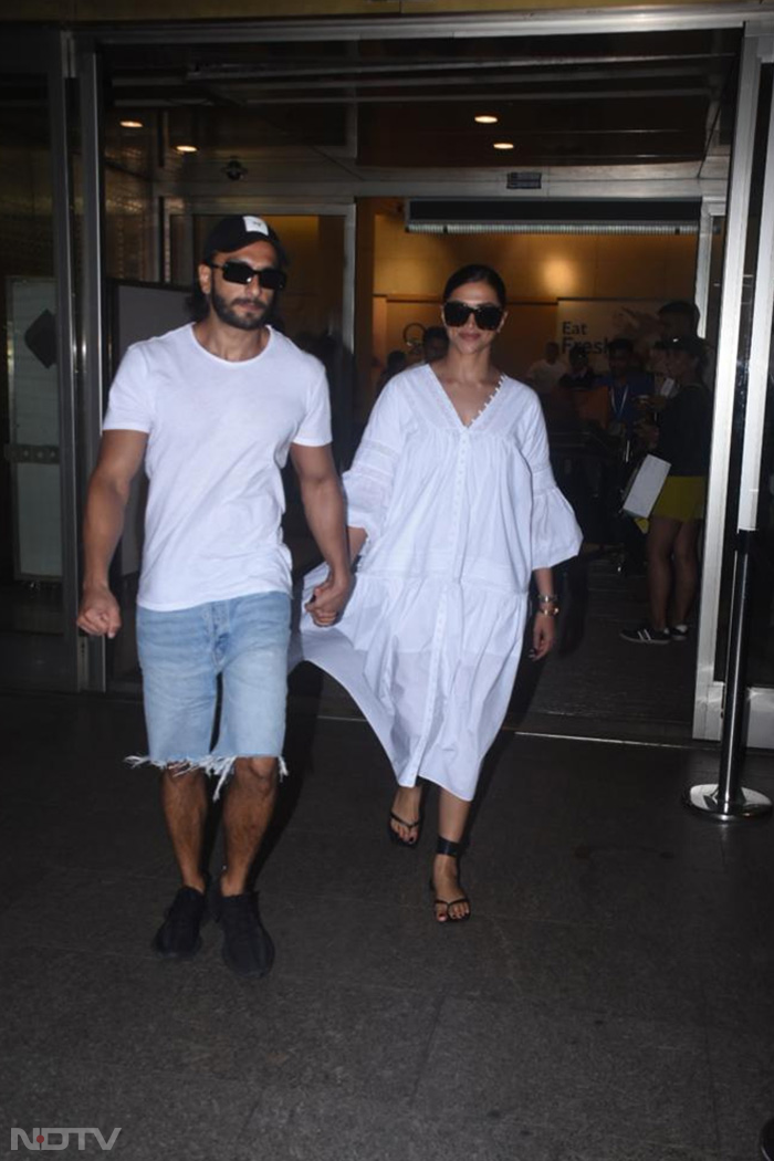 Deepika Padukone and Ranveer Singh twinned in white outfits. (Image Courtesy: Varinder Chawla)