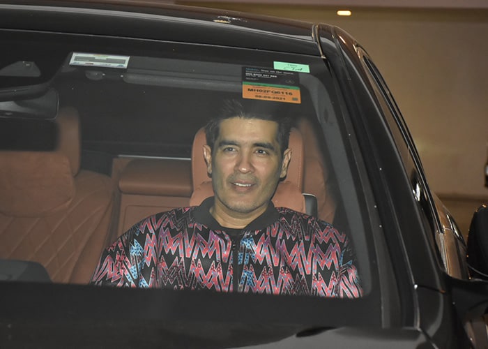 Ace designer Manish Malhotra was snapped arriving at BFF Karan Johar's birthday bash.