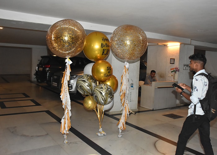 The entrance of Karan Johar's residence was decorated with golden and glittery balloons. One of the balloons read "Happy birthday KJo," while another read "50 & Fabulous".