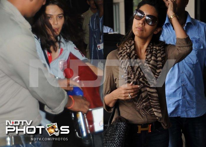 At the airport: Solemn Gauri, peek-a-boo Preity