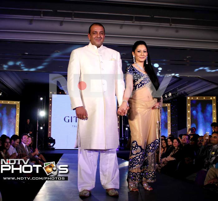 Sanjay and Maanyata Dutt, the new faces of Sangini, walked the ramp for the Gitanjali event.