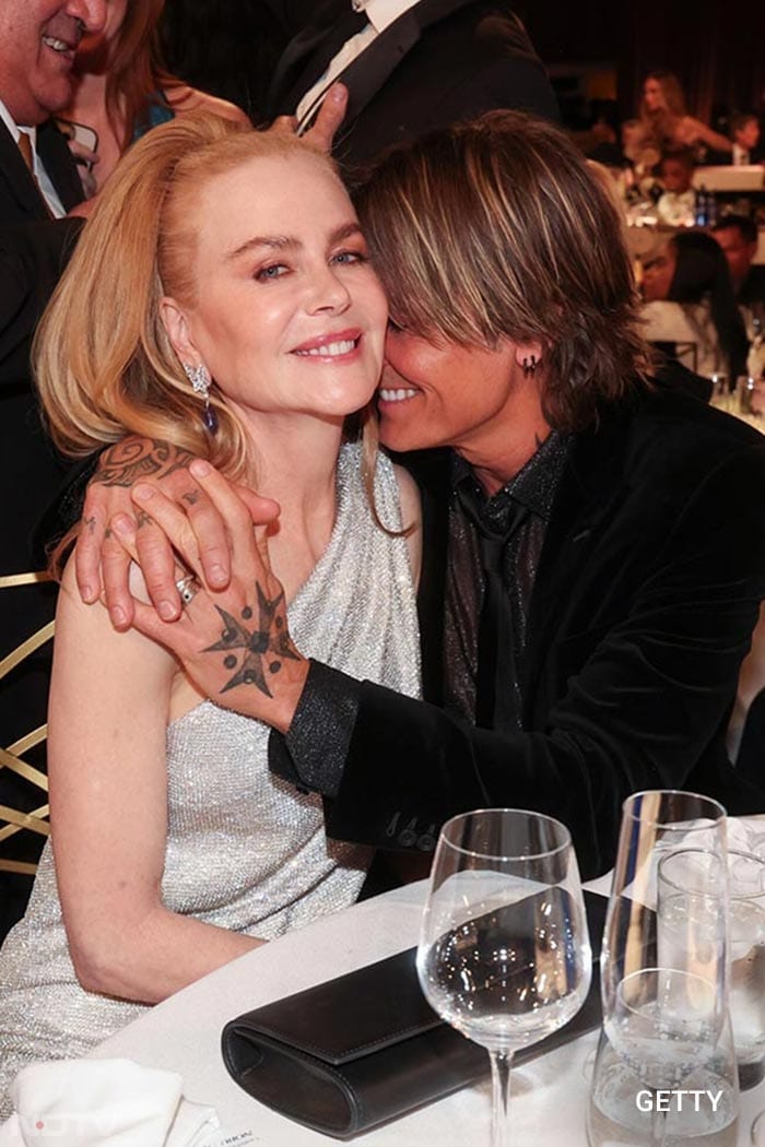 Nicole Kidman with husband Keith Urban, all cuddled up as they enjoyed the ceremony