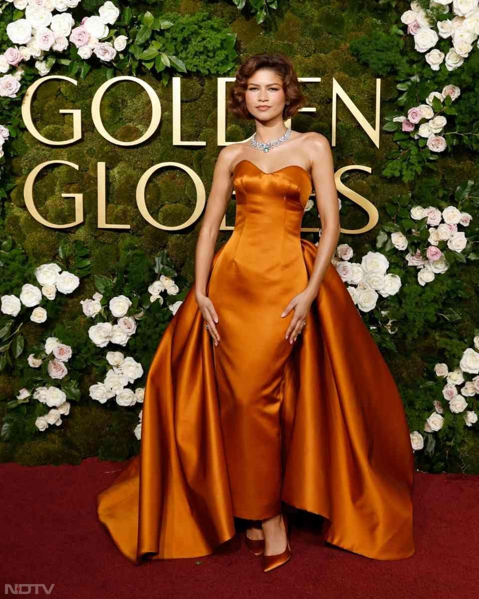 Zendaya attended the event in a custom burnt orange satin Louis Vuitton gown. (Image courtesy: Getty)