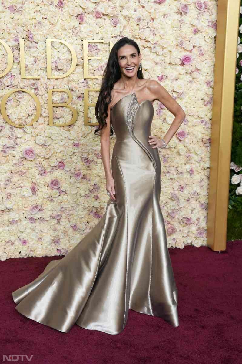 Demi Moore opted for a custom metallic ensemble from Armani Prive. (Image courtesy: Getty)