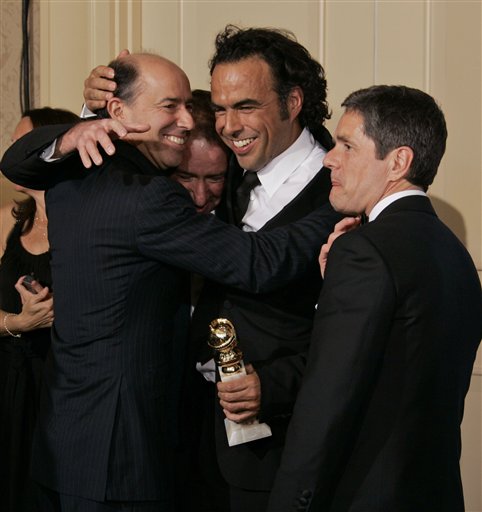 Director Alejandro Inarritu , center, celebrates with producers John Kilik, left,  and Steve Golin, second from left, and Paramount CEO Brad Grey after winning the award for best dramatic motion picture for Babel at the 64th Annual Golden Globe Awards.