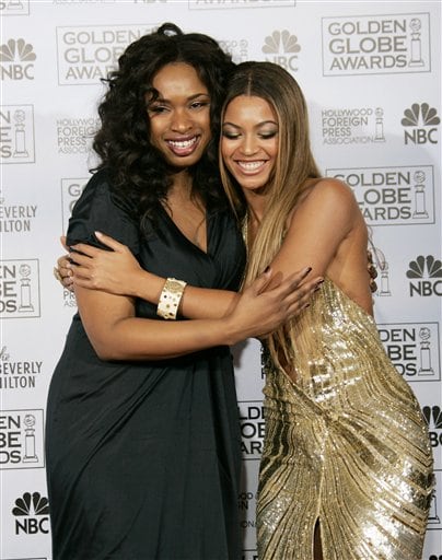 Jennifer Hudson, left, is hugged by her co-star, Beyonce Knowles, after Hudson won the award for  best supporting actress for her work in Dreamgirls at the 64th Annual Golden Globe Awards.