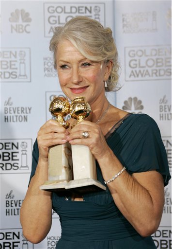 Helen Mirren poses with the awards she won for best actress in a drama for her work in The Queen and best actress in a mini-series or television movie for her work on Elizabeth I, at the 64th Annual Golden Globe Awards.