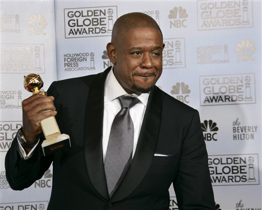 Forest Whitaker poses with the award he won for best actor in a drama for his work in The Last King of Scotland, at the 64th Annual Golden Globe Awards.