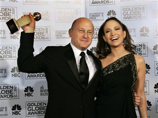 Producer Lawrence Mark poses with presenter Jennifer Lopez with the award for best motion picture musical or comedy for Dreamgirls at the 64th Annual Golden Globe Awards.