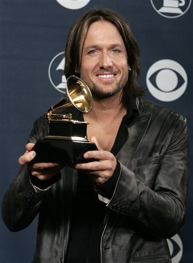 Australia's country singer Keith Urban holds his Grammy award for Best Male Country Vocal Performance at the 48th Annual Grammy Awards.