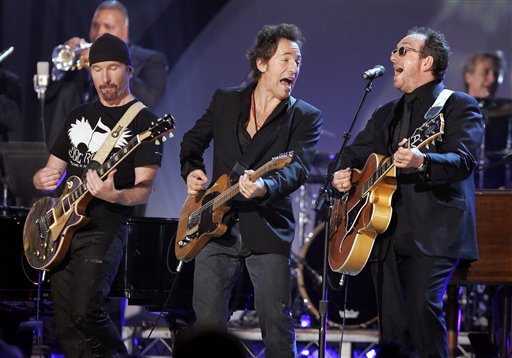 The Edge, Bruce Springsteen and Elvis Costello perform at the 48th Annual Grammy Awards.