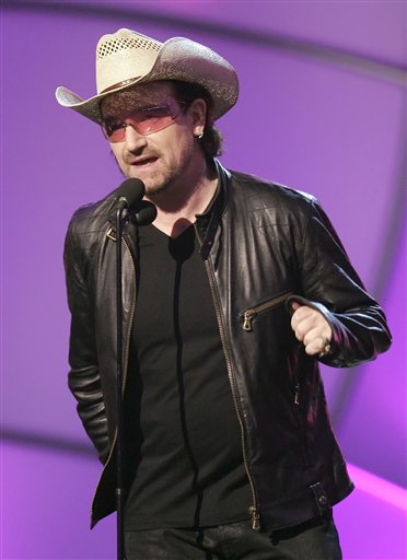 Bono from the group U2 accepts the award for song of the year for Sometimes You Can't Make it on Your Own at the 48th Annual Grammy Awards.