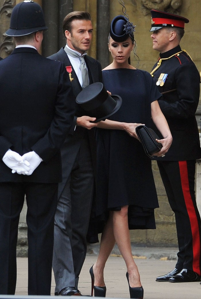 Soccer star David Beckham was dapper in a Ralph Lauren morning suit with his hair slicked back. He wore his OBE medal pinned on the right. Victoria matched him in a dress from her own collection. The Beckhams were among the earliest arrivals (Photo: AP)