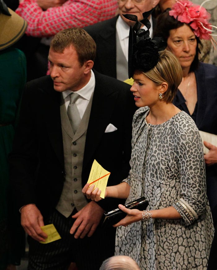 British film director Guy Ritchie and his girl friend Jacqui Ainsley arrive for the wedding. (Photo: AP)